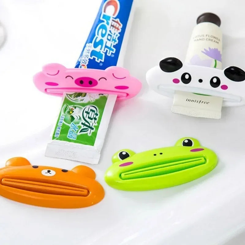 Lindo dispensador de pasta de dientes en caricatura enrollable, clips para limpiador facial, soporte de pasta de dientes para niños, ahorrador de tubo, accesorios de baño