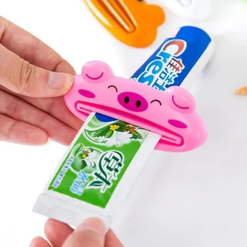 Lindo dispensador de pasta de dientes en caricatura enrollable, clips para limpiador facial, soporte de pasta de dientes para niños, ahorrador de tubo, accesorios de baño