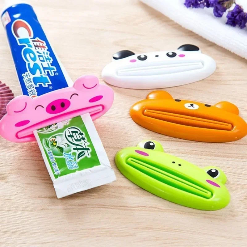 Lindo dispensador de pasta de dientes en caricatura enrollable, clips para limpiador facial, soporte de pasta de dientes para niños, ahorrador de tubo, accesorios de baño